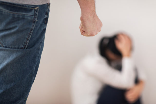 Domestic Violence, Abuse And People Concept - Man Beating Helpless Woman At Home